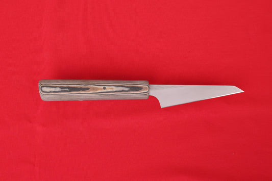 Smalll kitchen knife on red background. Petty with Richite handle in brown, black and beige.