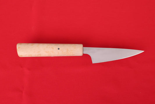Small kitchen knife on red background. Petty with Richlite handle.