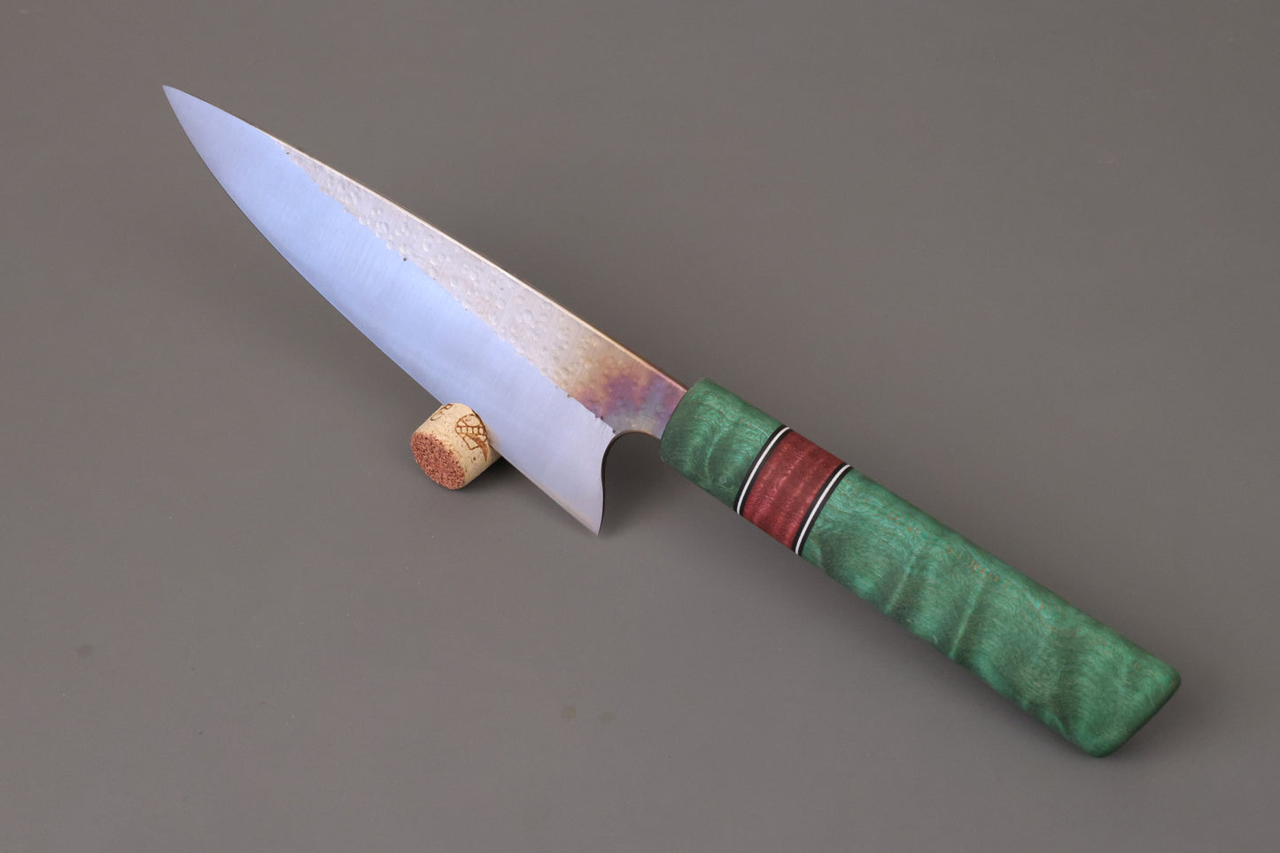 Chef knife with stabilized and green dyed wooden handle.