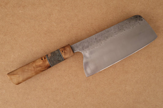 Traditional knife with wooden handle on a brown background