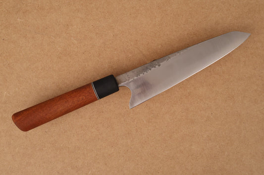Knife with a wooden handle on a brown background