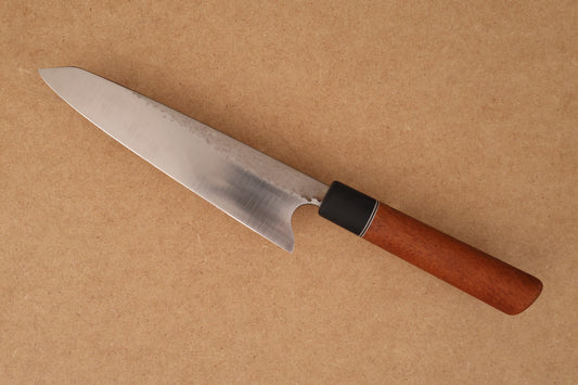 Gyuto with wooden handle on brown background