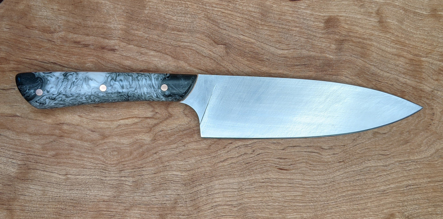 kitchen knife with black and white handle