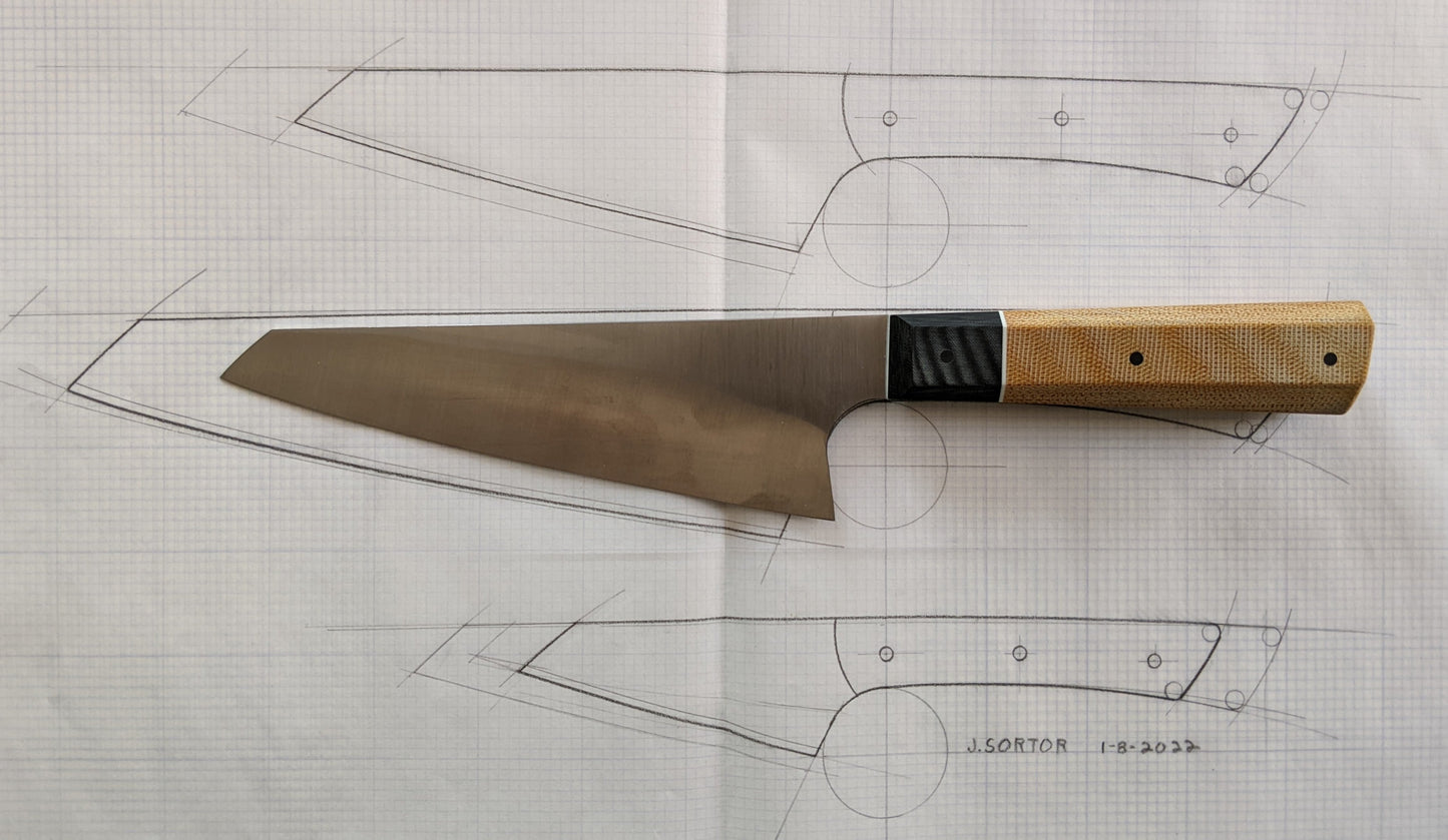 Japanese kitchen knife with drawing in background