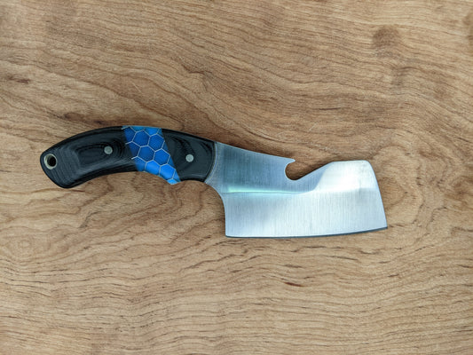 small cleaver with bottle opener on wooden background
