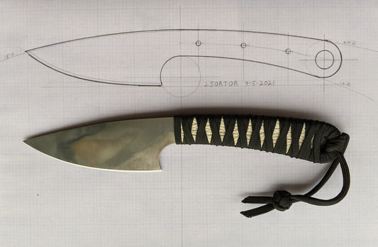 small knife with drawing as background