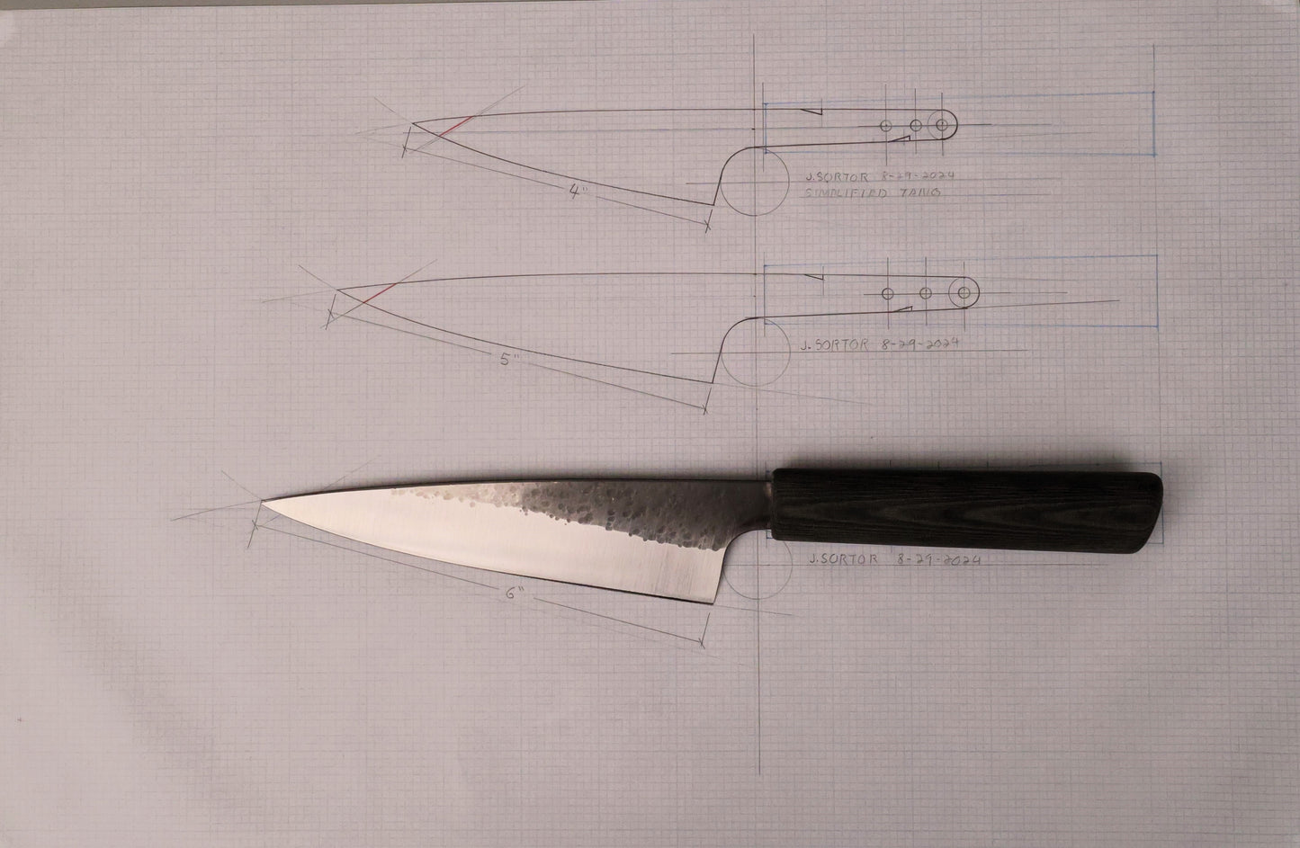 kitchen knife on graph paper with knife drawings