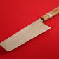Nakiri with wooden handle on a red background.