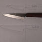 small kitchen knife on top of drawings of knives