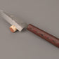Small kitchen knife, with Richlite handle, in a wine cork 