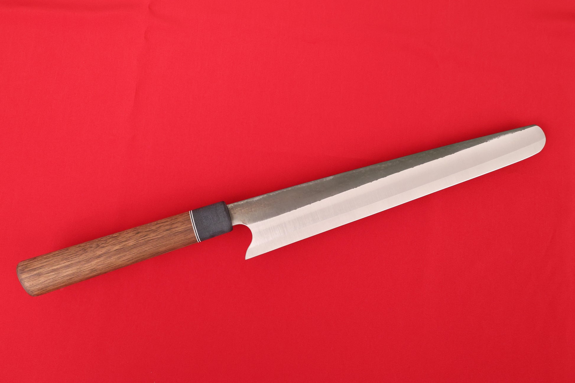 large slicing knife on red background