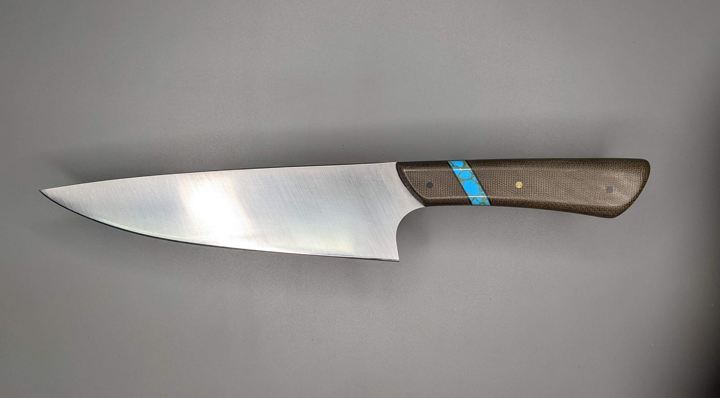 kitchen knife with green and blue handle 