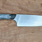 kitchen knife with black and white handle 