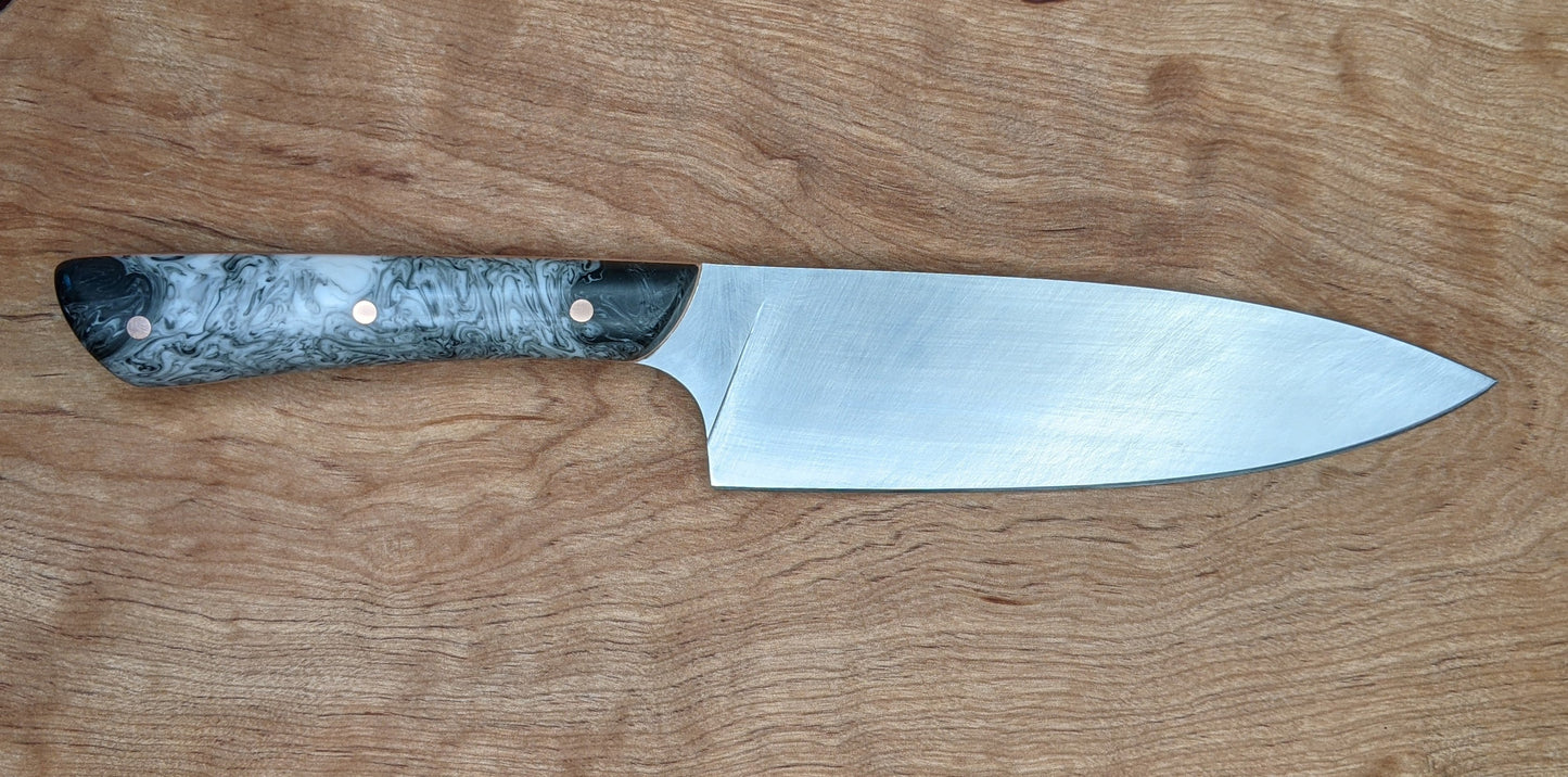 kitchen knife with black and white handle 