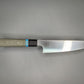 Japanese style kitchen knife with Green Micarta handle and black bolster.