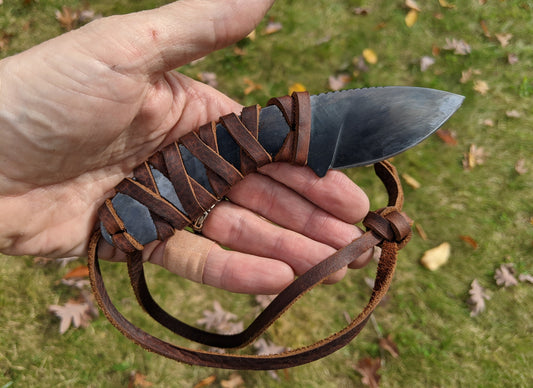 small knife with gun blue finish and leather wrap