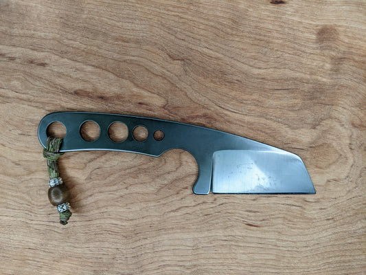 EDC knife on wooden background.